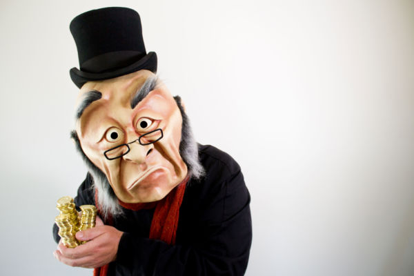 Photo by Kate Braidwood • Dimensions: 5052 x 3368px • File Type: JPG • File Size: 1MB Ebeneezer Scrooge clutches a stack of gold coins. From 'A WONDERHEADS Christmas Carol' by WONDERHEADS, a physical theatre company specializing in full-face mask performance.