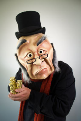 Photo by Kate Braidwood • Dimensions: 3338 x 5007px • File Type: JPG • File Size: 2MB Ebeneezer Scrooge clutches a stack of gold coins. From 'A WONDERHEADS Christmas Carol' by WONDERHEADS, a physical theatre company specializing in full-face mask performance.