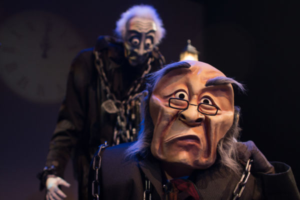 Marley’s Ghost looms behind Ebenezer Scrooge in ‘A WONDERHEADS Christmas Carol,’ a whimsical reimagining of the holiday classic touring BC theatres this December. Kate Braidwood as Scrooge, Jessica Hickman as Marley. Photo by Daryl Turner (Dimensions: 4000 x 2666px • File Type: JPG • File Size: 3MB) Marley’s Ghost looms behind Ebenezer Scrooge. From 'A WONDERHEADS Christmas Carol' by WONDERHEADS, a physical theatre company specializing in full-face mask performance.